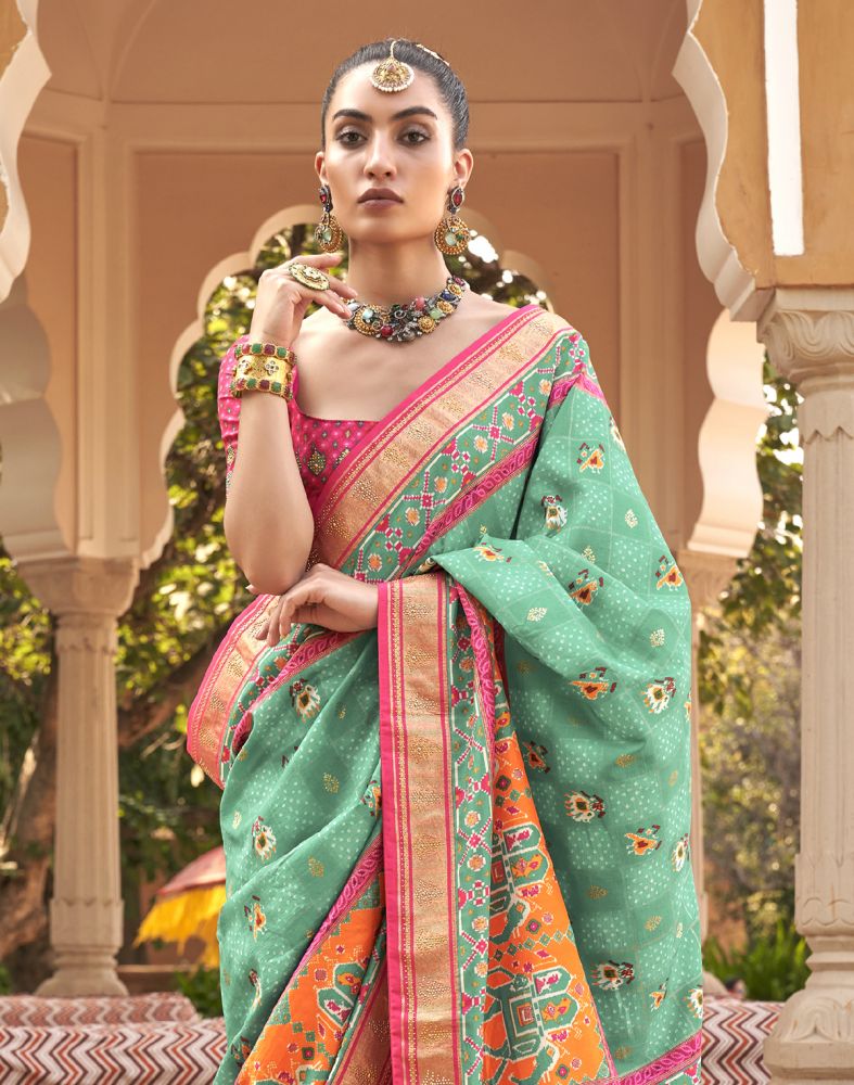 Patola Fabric Ligh Green Ikat Mirror work Saree