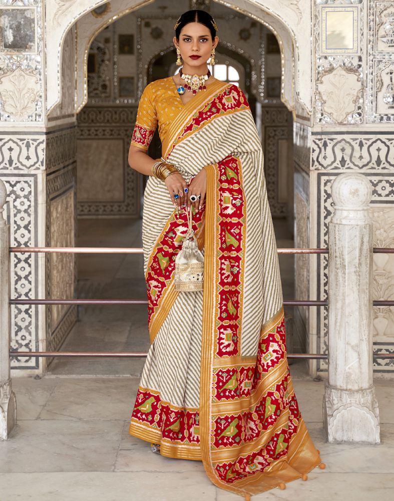 Look Stylish Off White Ikat Print Patola Saree