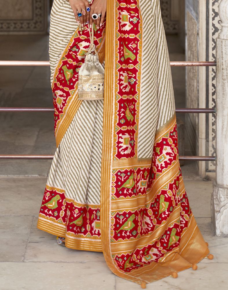 Look Stylish Off White Ikat Print Patola Saree