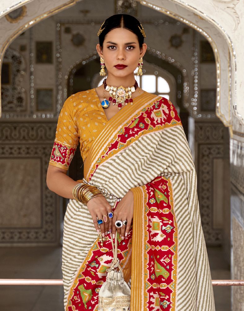 Look Stylish Off White Ikat Print Patola Saree