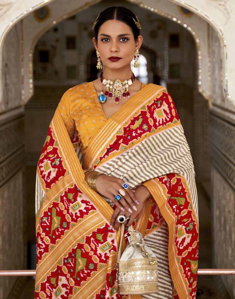 Look Stylish Off White Ikat Print Patola Saree